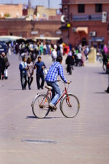 Fototapeta na wymiar Man riding a bike in the city