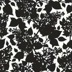 Spectacular black and white botanical print. Abstract seamless pattern with silhouettes of lilac flowers and leaves.