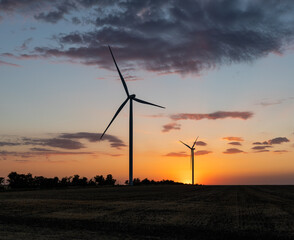 Fototapeta na wymiar Wind turbines at sunset