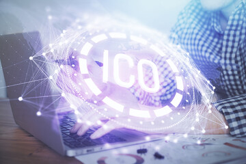 Blockchain theme hologram with man working on computer on background. Concept of crypto chain. Double exposure.