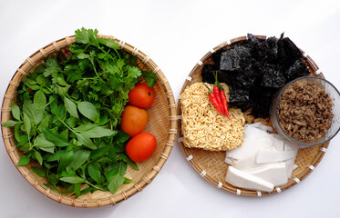 raw material for Vietnamese vegetarian soup from instant noodles, mushroom, dried seaweed, sour bamboo shoot, cilantro, basil