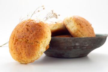 Fresh muffin in white background and old copper bowl