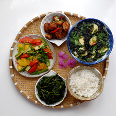 Vietnamese vegan cuisine, daily meal, seaweed, tofu soup, fried vegetables, dried bread cook with sauce, boiled water spinach