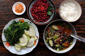 Vietnamese vegan food, boiled gourd, water spinach, tofu cheese, fried peanut, seaweed soup, simple dish good for health