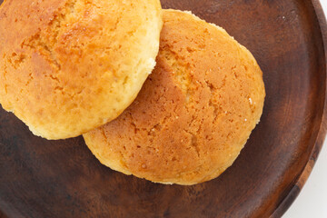 Fresh muffin on a wooden serving board