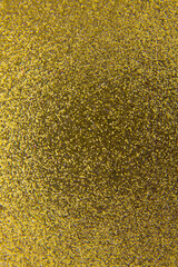 Gold glittering shiny festive background with texture.