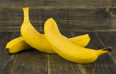 Bananas on a wooden background close-up.