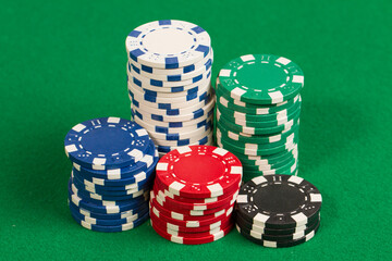 Various colors Casino Playing Poker Chips. Abstract Pattern Background. Isolated on green background table