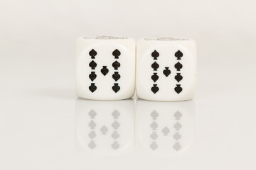 Two Nines Playing Casino poker dice closeup Isolated on white background with reflection. Abstract Pattern