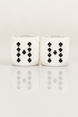 Two Nines Playing Casino poker dice closeup Isolated on white background with reflection. Abstract Pattern