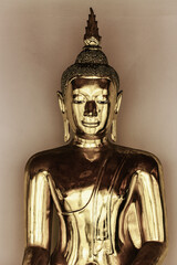 Close up Brass buddha statue in the temple.