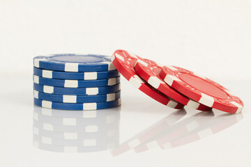 Red and Blue Playing Casino Poker Chips. Isolated on white background with reflection. Abstract Pattern