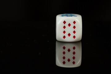 Casino playing poker dice ten isolated on black background.