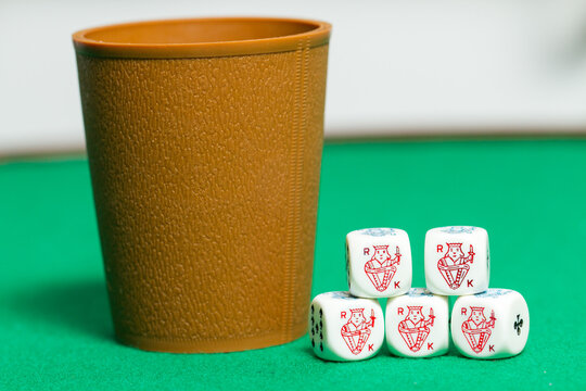 Playing Poker Dice Kings Closeup On A Cup With Green Background