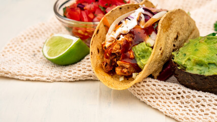 Mexican traditional authentic homemade tacos with pulled pork beef chili con carne serve with...