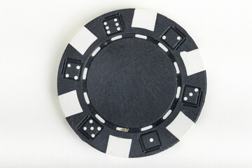 Black playing poker chip isolated on white background.