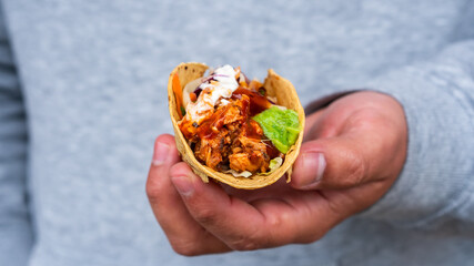 Mexican traditional authentic homemade tacos with pulled pork beef chili con carne serve with tomato salad and avocado guacamole and dip sauce
