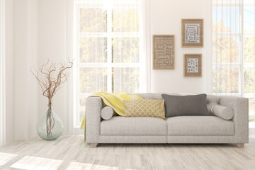 White room with sofa and autumn landscape in window. Scandinavian interior design. 3D illustration