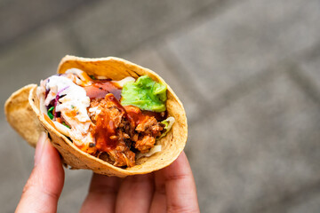 Mexican traditional authentic homemade tacos with pulled pork beef chili con carne serve with tomato salad and avocado guacamole and dip sauce