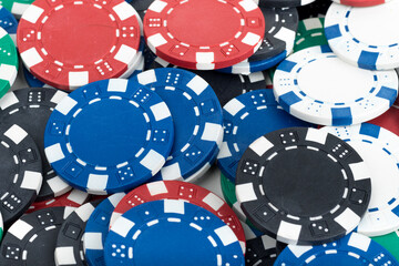 Playing Poker Chips laying on the table mixed together. Abstract Pattern Background