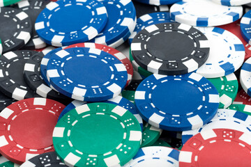 Playing Poker Chips laying on the table mixed together. Abstract Pattern Background