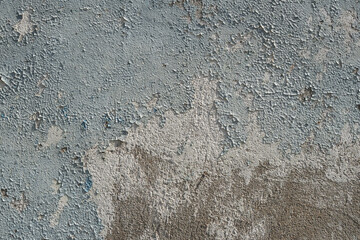 Old gray concrete wall. Panoramic textured background of ancient wall with peeling plaster.