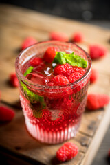 Old fashioned raspberry cocktail. Selective focus. Shallow depth of field.