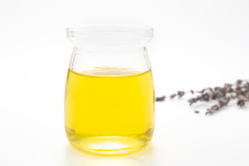 Olive oil in a bottle on a white background
