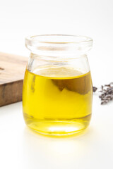 Olive oil in a bottle on a white background