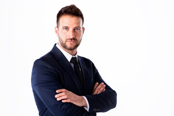 Studio shot of businessman standing with arms crossed at isolated white background