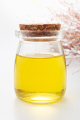 Olive oil in a bottle on a white background