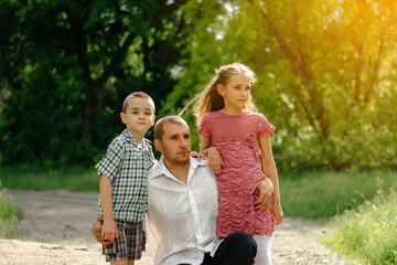 Father and children look into the distance. Happy family.