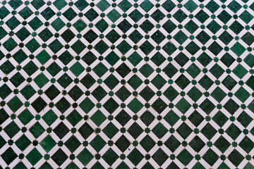 An arabian green and white mosaic with shape tiles