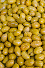 Vertical photo of a pile of green olives