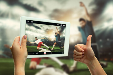 Close up hands holding tablet viewing sport, football online streaming of championship. New rules during coronavirus outbreak and countries lockdown. Concept of sport, competition, technologies.