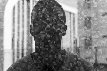 Fototapeta na wymiar Young man with double exposure effect in black and white