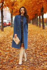 Stylish woman in autumn park
