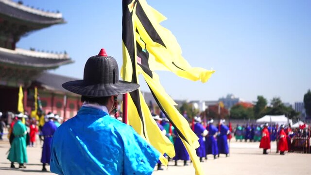 Slow motion of royal guard holding flag at Gyeongbokgung Palace