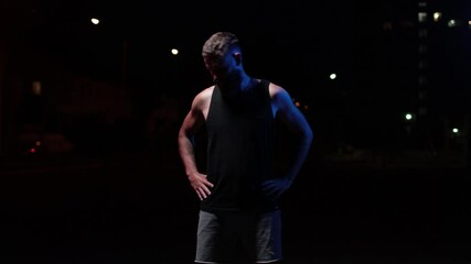 Man training outdoor at night at local sports ground