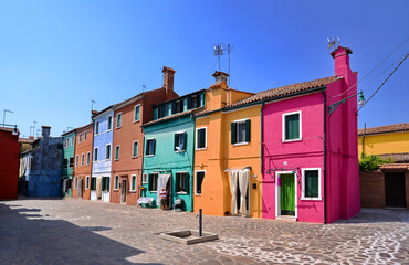 Fototapeta na wymiar Italy, Venice, Burano - May 2019 Colorful houses in a clear sunny day 