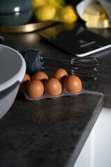 hand mixer, bowl and eggs for backing at home