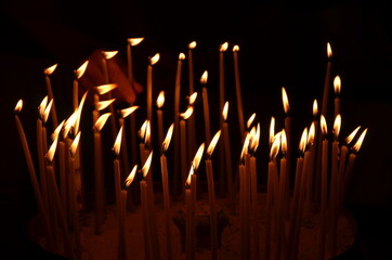 burning candles in a church