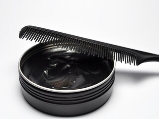 Hair pomade or waxe and comb isolated on white background