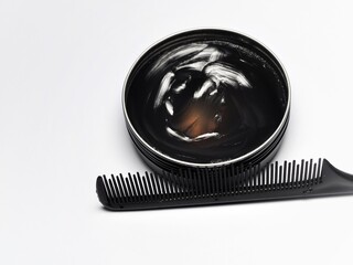 Hair pomade or waxe and comb isolated on white background