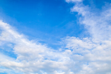 Naklejka na ściany i meble Blue sky background with tiny clouds. Blue sky background with clouds.