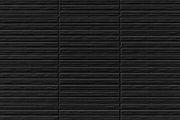 Modern black stone wall with stripes texture and seamless background