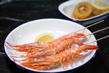 Beer pub. Seafood snack for beer. Langoustines, beer, squid rings.
