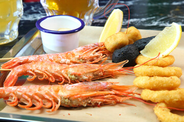 Beer pub. Langoustines and beer. Beer and seafood snacks. Langoustines, beer, squid rings. 