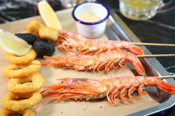 Beer pub. Langoustines and beer. Beer and seafood snacks. Langoustines, beer, squid rings. 