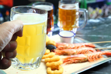 Beer pub. Langoustines and beer. Beer and seafood snacks. Langoustines, beer, squid rings. 